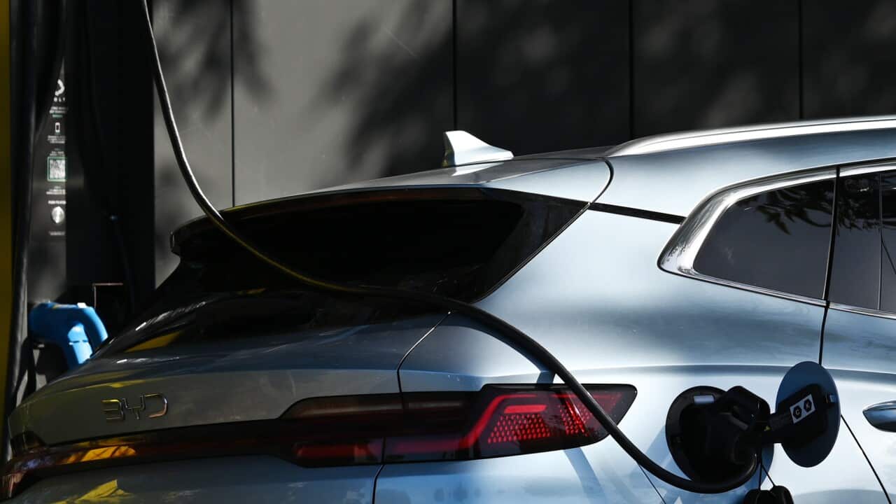 An electric vehicle being charged.