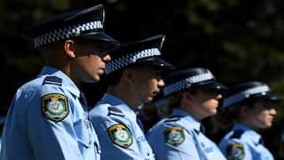 NSW Police stand at attention during a service to honour fallen members of the NSW Police Force in Sydney Friday, September 28, 2018. (AAP Image/Joel Carrett) NO ARCHIVING