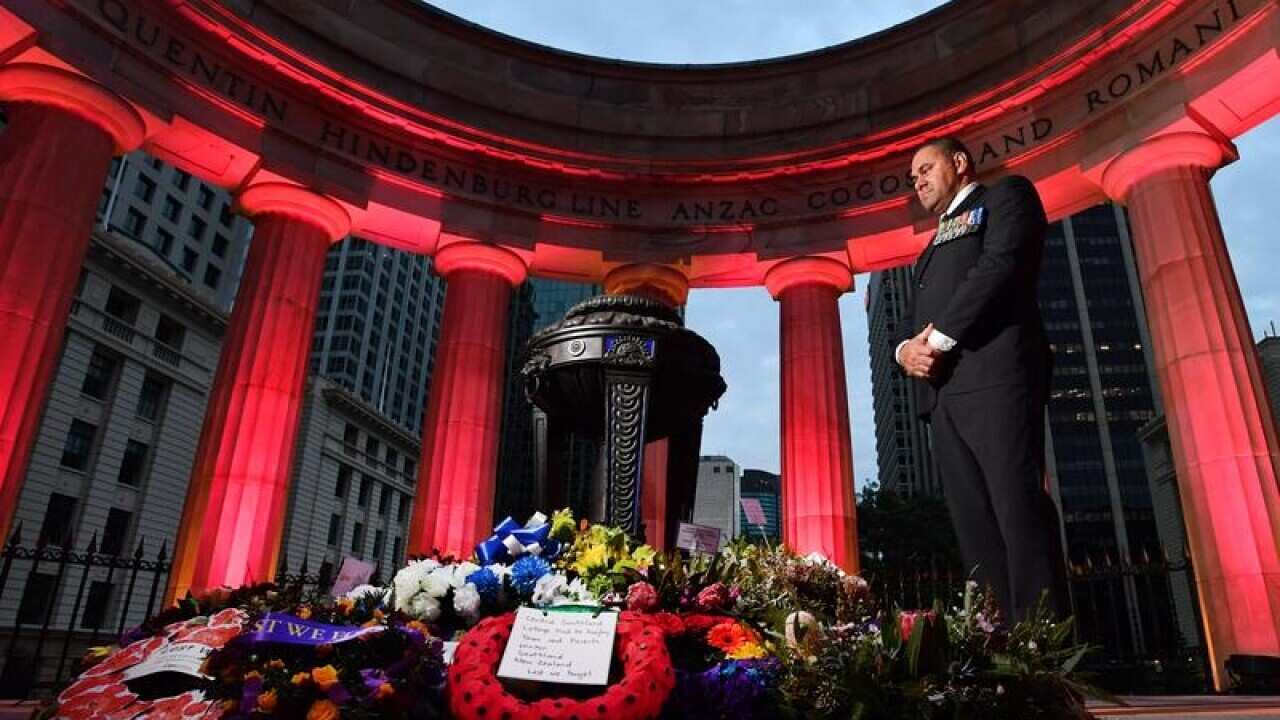 People laying flowers at Brisbane's Anzac Square.