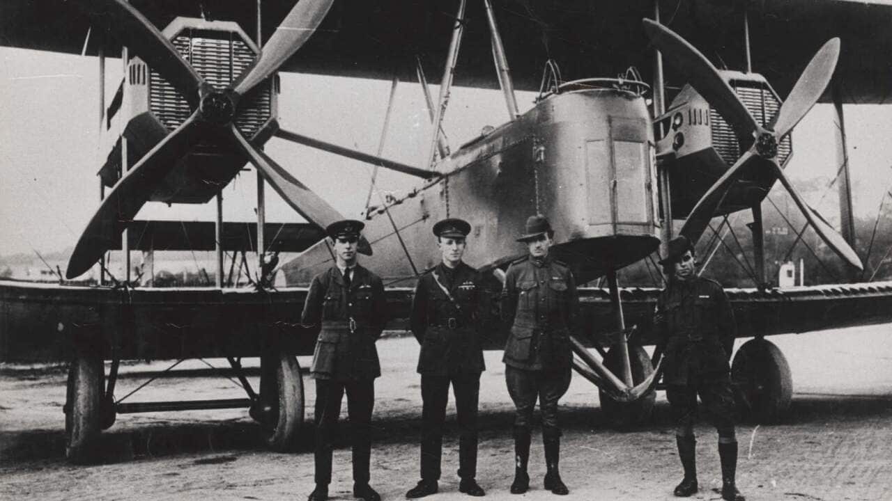 Captain Ross Smith, brother and lieutenant Keith Smith, with mechanics Jim Bennett and Wally Shiers, in front of their Vickers Vimy