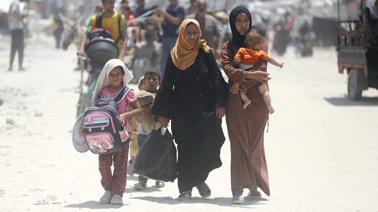 People flee from the eastern districts of the southern Gaza Strip city of Khan Younis, on July 22, 2024
