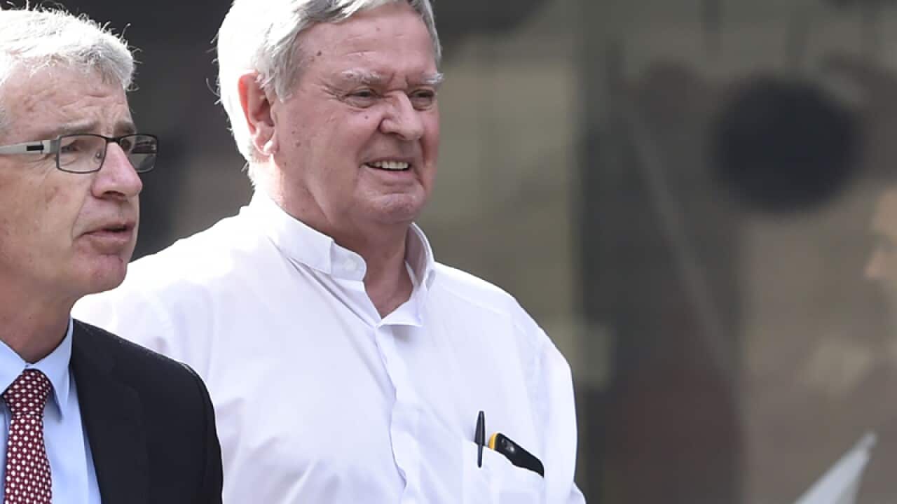 Brisbane bishop and former Ballarat vicar-general Brian Finnigan (R)