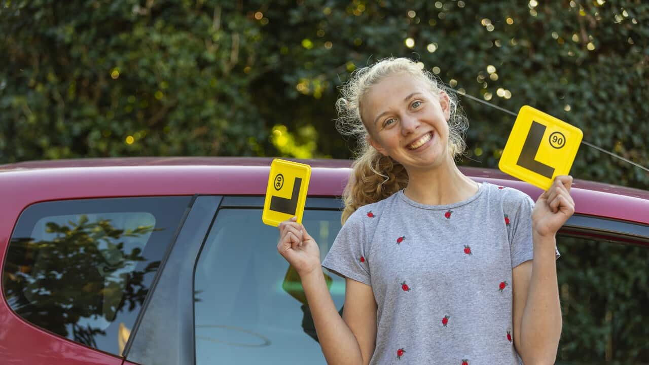 Teenage Girl Celebrating Learning to Drive