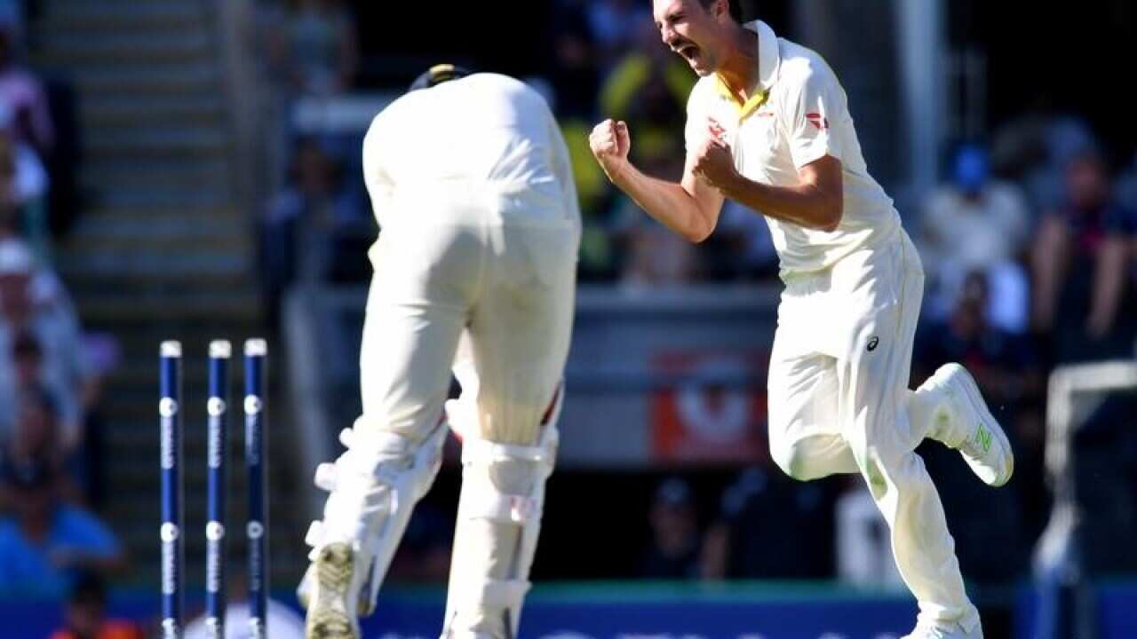 Pat Cummins of Australia celebrates after taking a wicket