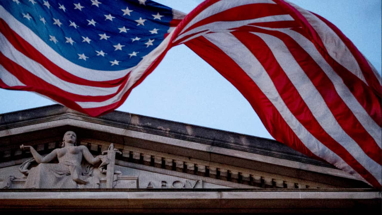 American flag flies outside the Department of Justice in Washington. 