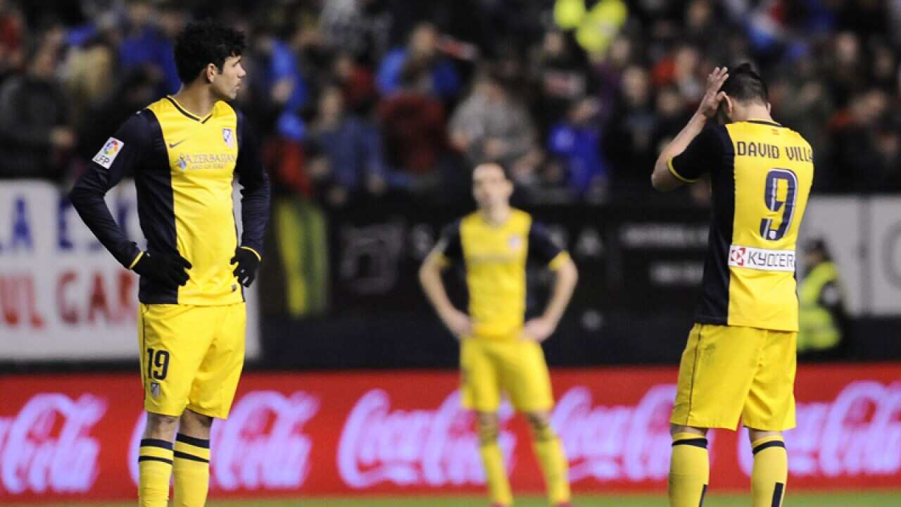 Atletico Madrid players react