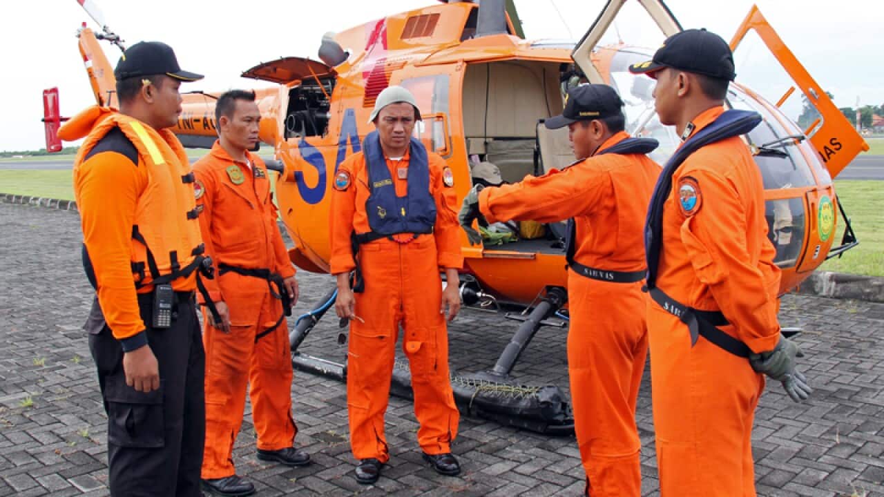 A rescue team prepares to search for seven missing Japanese tourists