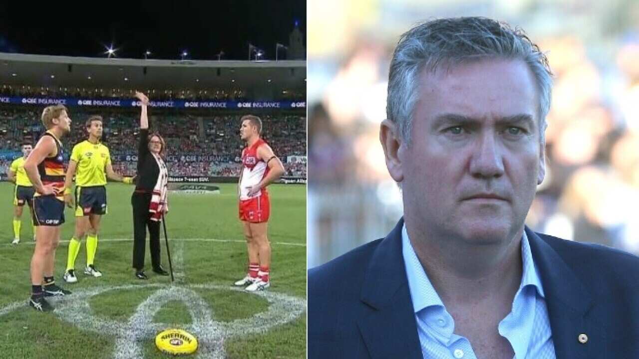 Double amputee Cynthia Banham tosses the coin at the SCG (L) and Eddie McGuire.