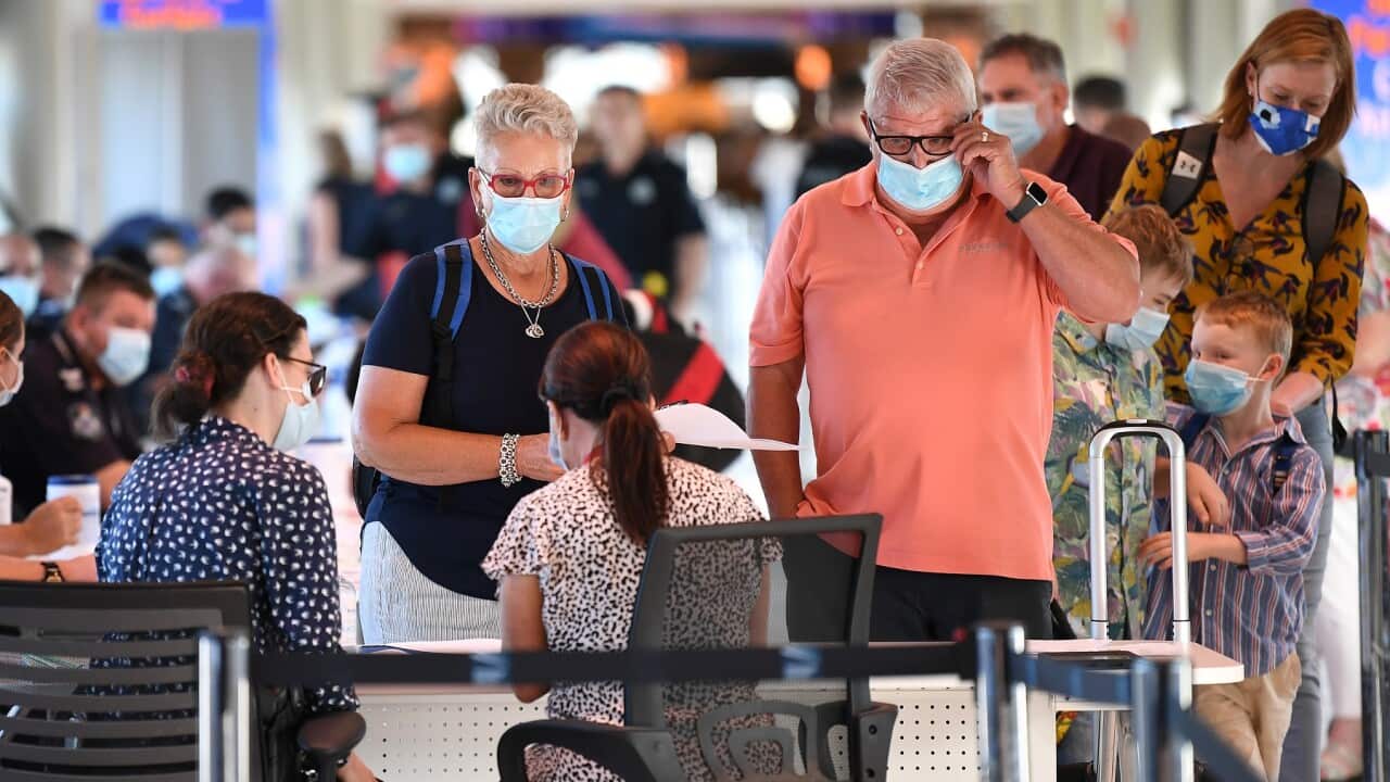 Incoming passengers are screened by police at Brisbane Airport