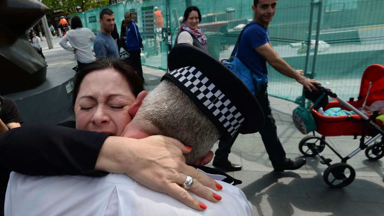 7/7 survivor Gill Hicks hugs PC Andy Maxwell