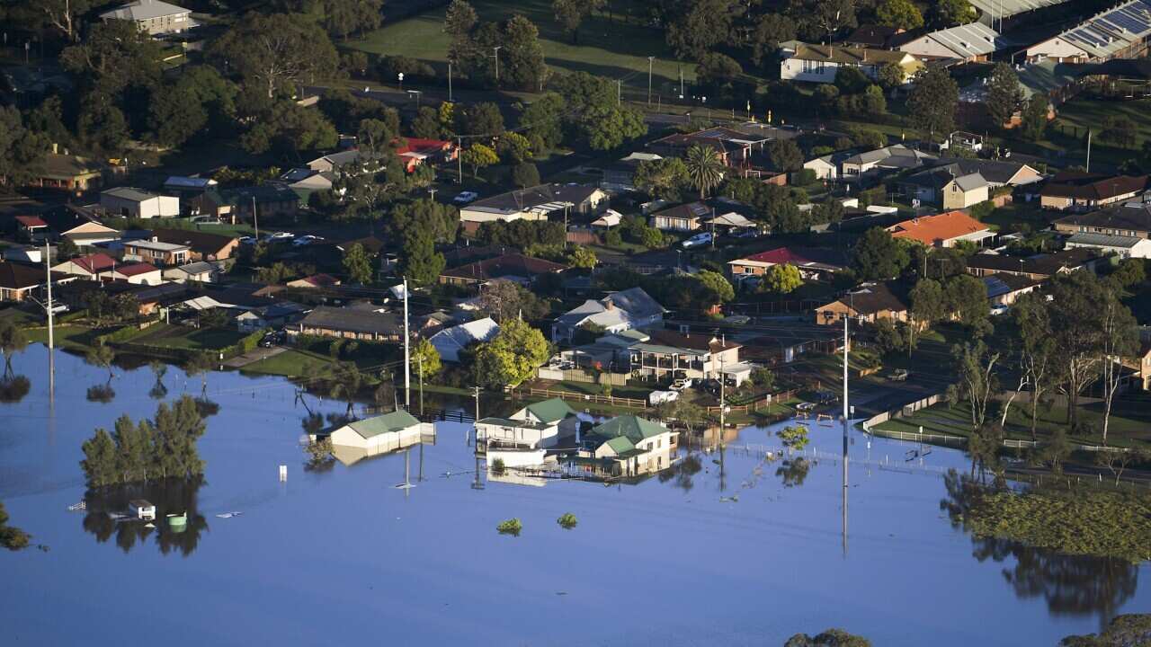 Buildings are partially submerged in floodwaters in the Windsor area, northwest of Sydney