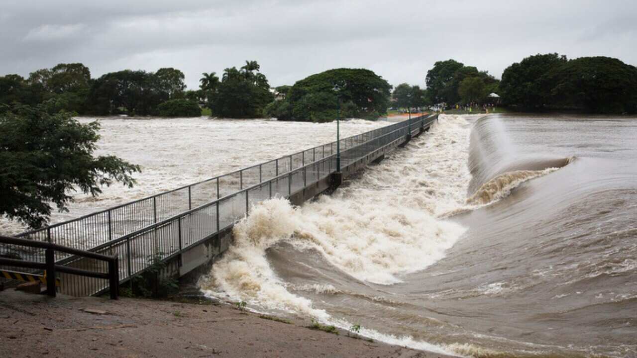 Floodwaters are seen at Aplins Weir in Townsville, Friday, February 1, 2019. Townsville residents are again being told to leave their homes as north Queensland's flood disaster rolls on. (AAP Image/Andrew Rankin) NO ARCHIVING