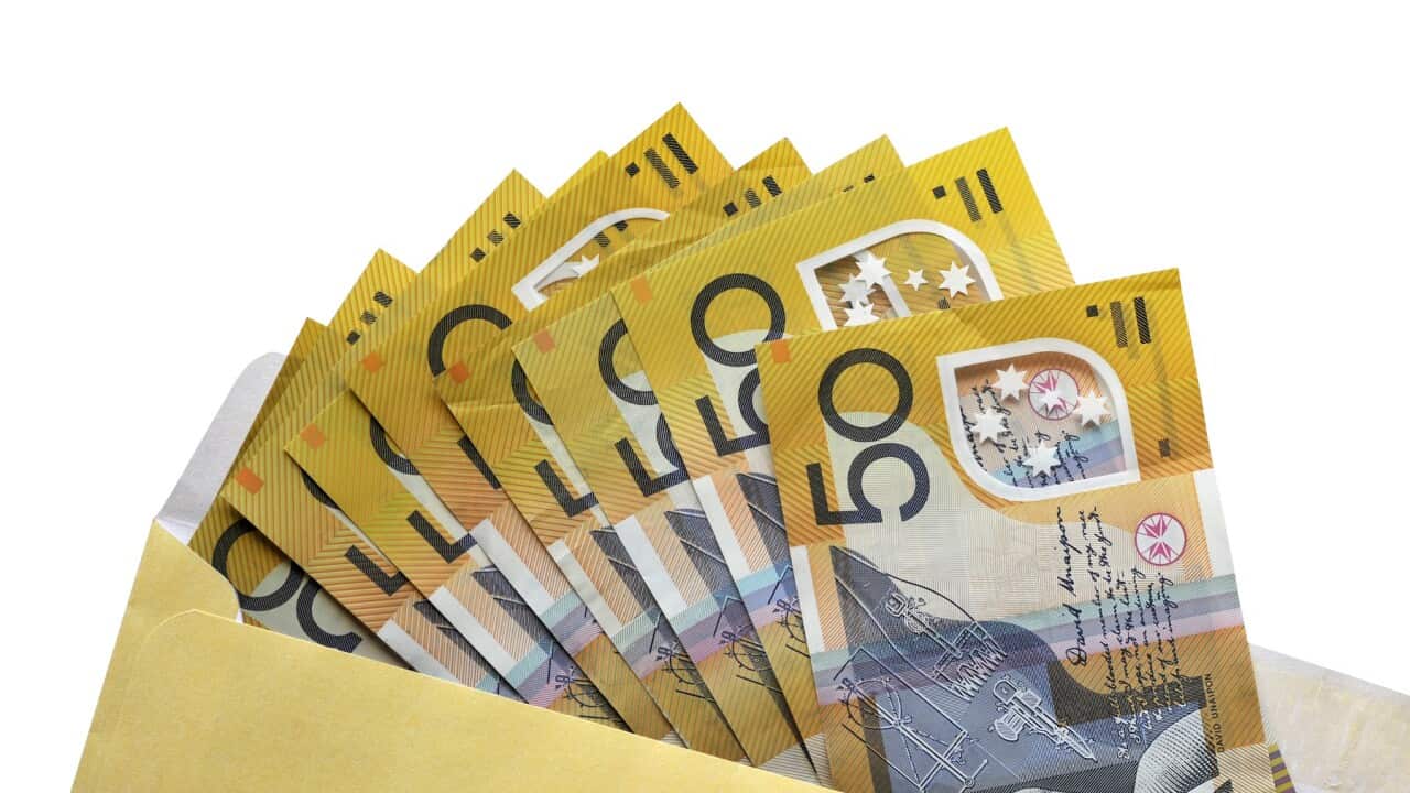 Open envelope of Australian fifty dollar notes