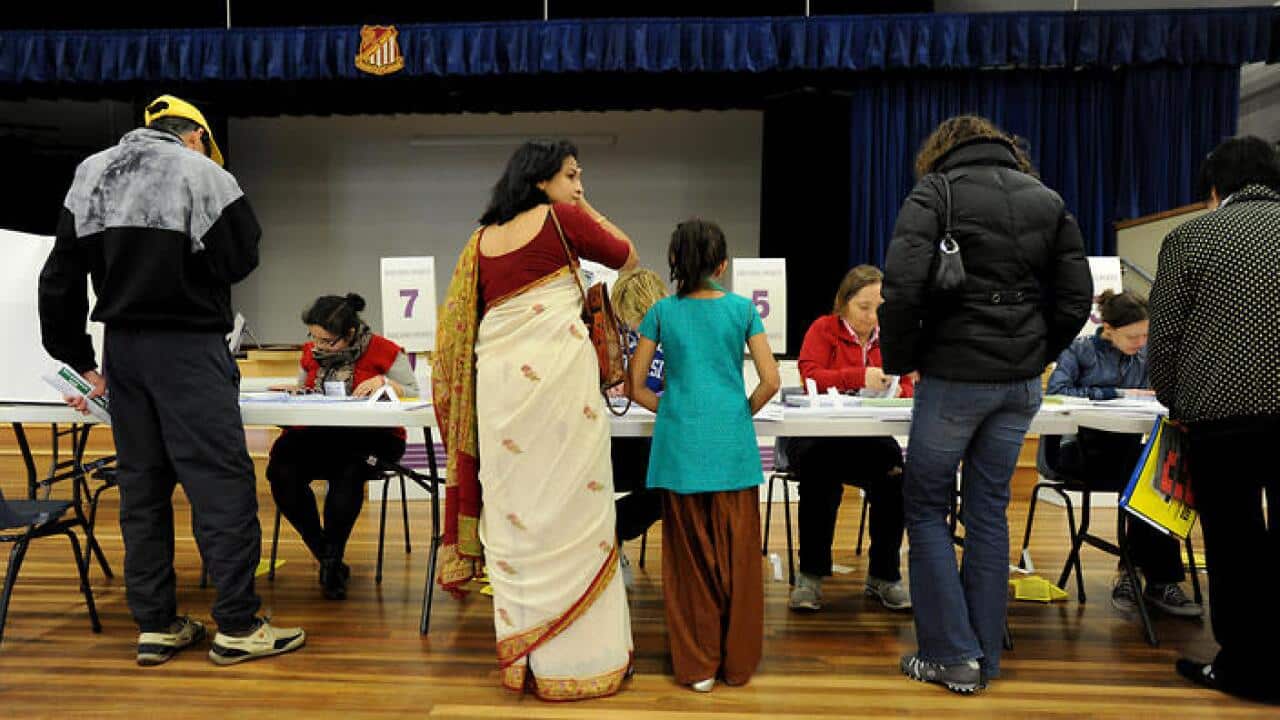 Voters queue at a polling booth at West Epping Public School in the electorate of Bennelong in Sydney, Saturday, Aug. 21, 2010. (AAP Image/Tracey Nearmy) NO ARCHIVING