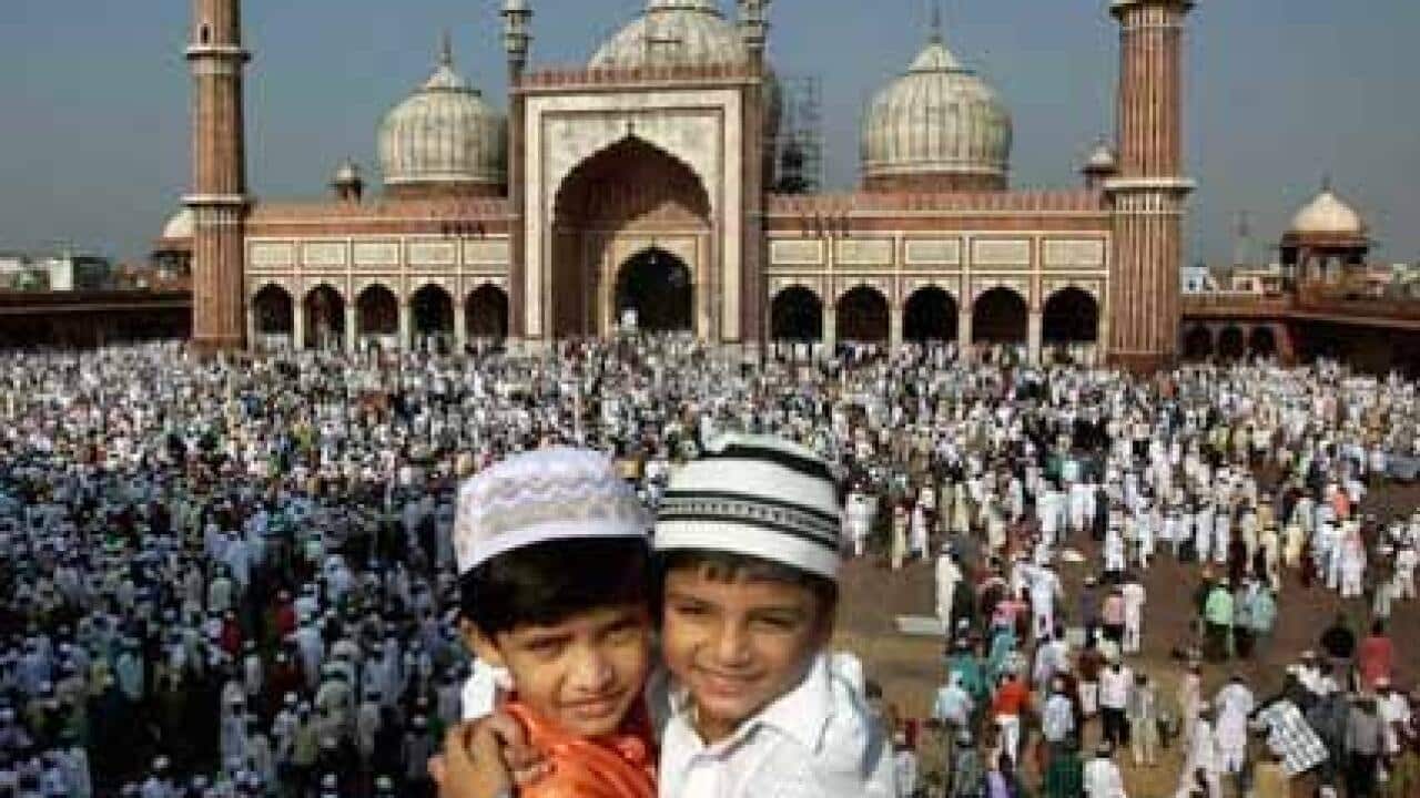 Children wishing each other Eid Mubarak