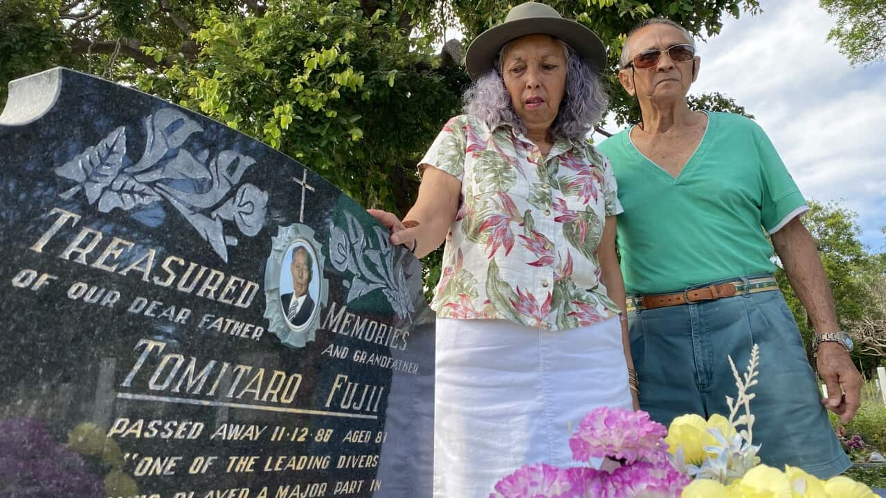 Chiomi and Russell Fujii at the grave of their father on Thursday Island.