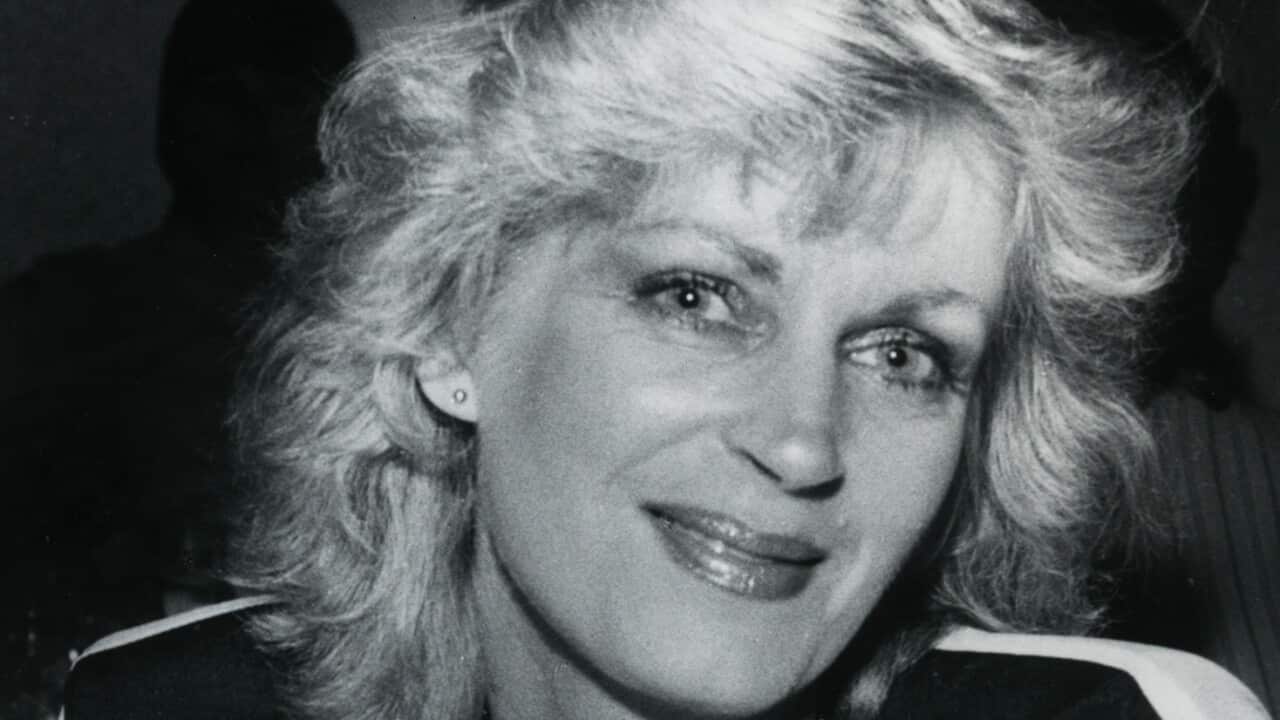 A black and white photo of a woman with shoulder length hair.