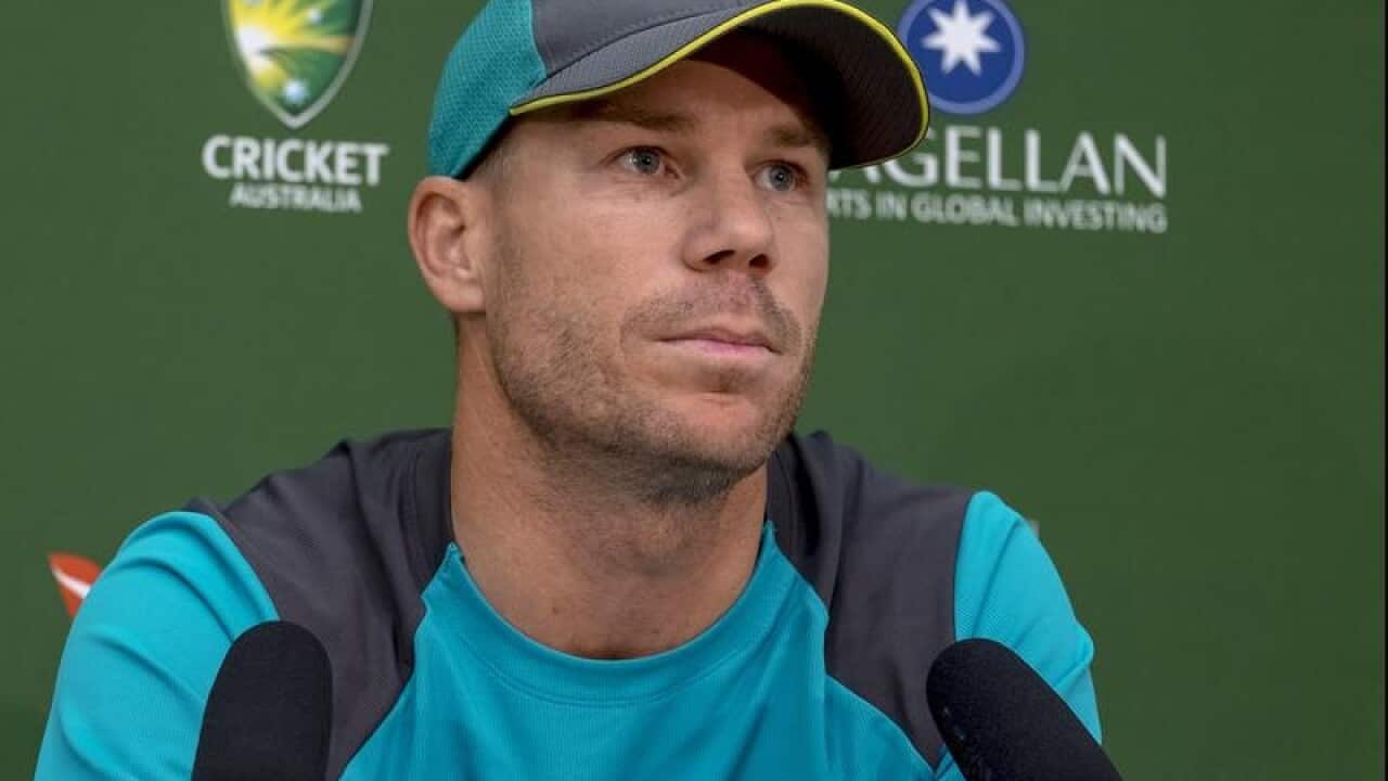 Australian cricket player David Warner gives a press conference