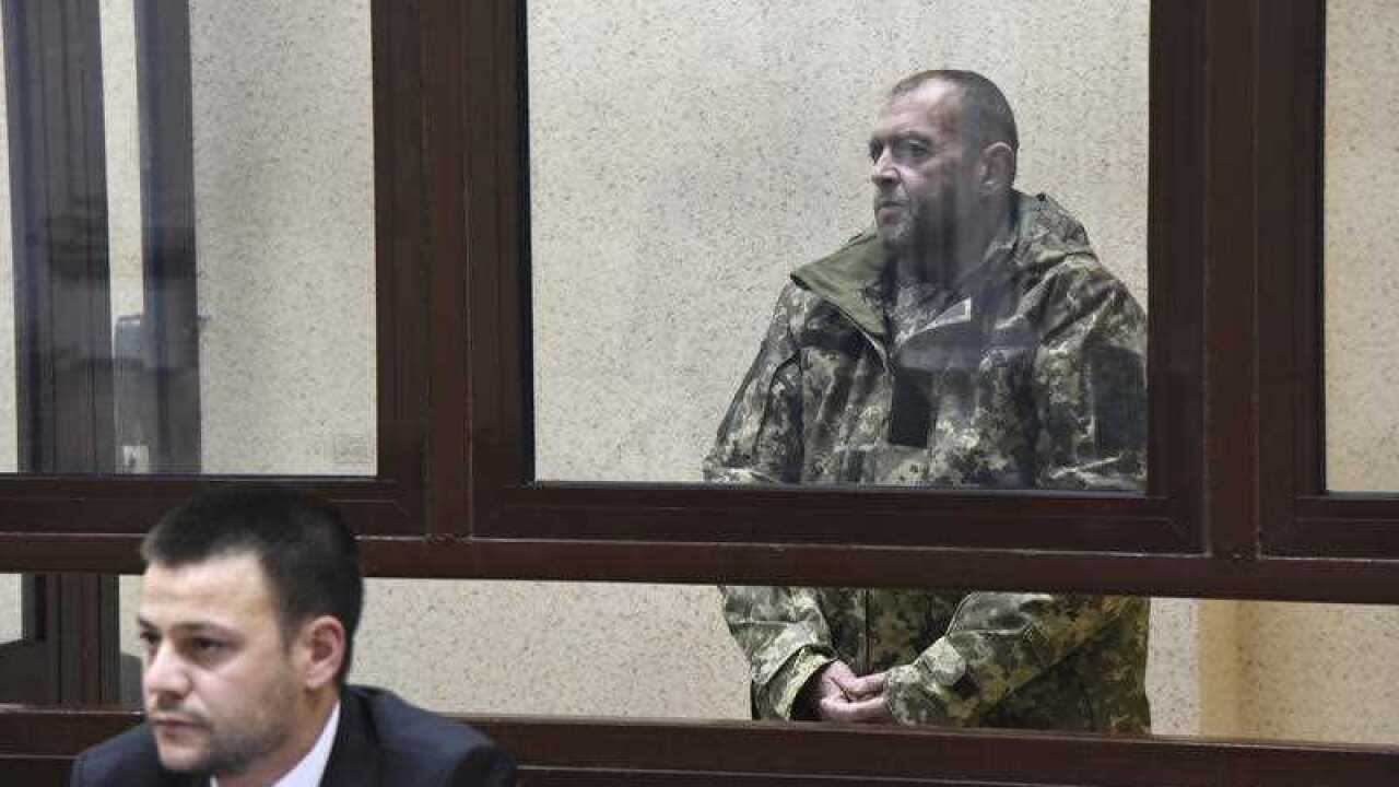 One of the captured Ukrainian sailors speaks in a court room in Simferopol, Crimea.
