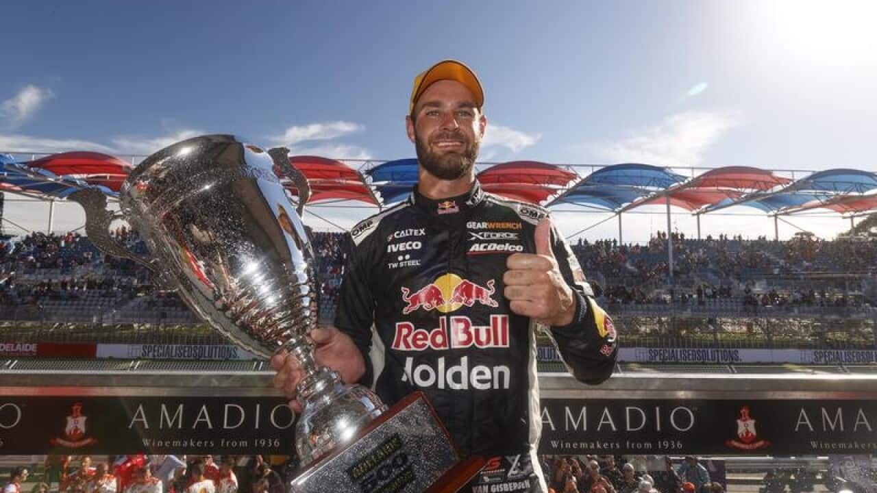 Shane van Gisbergen holds his trophy at the Adelaide 500.