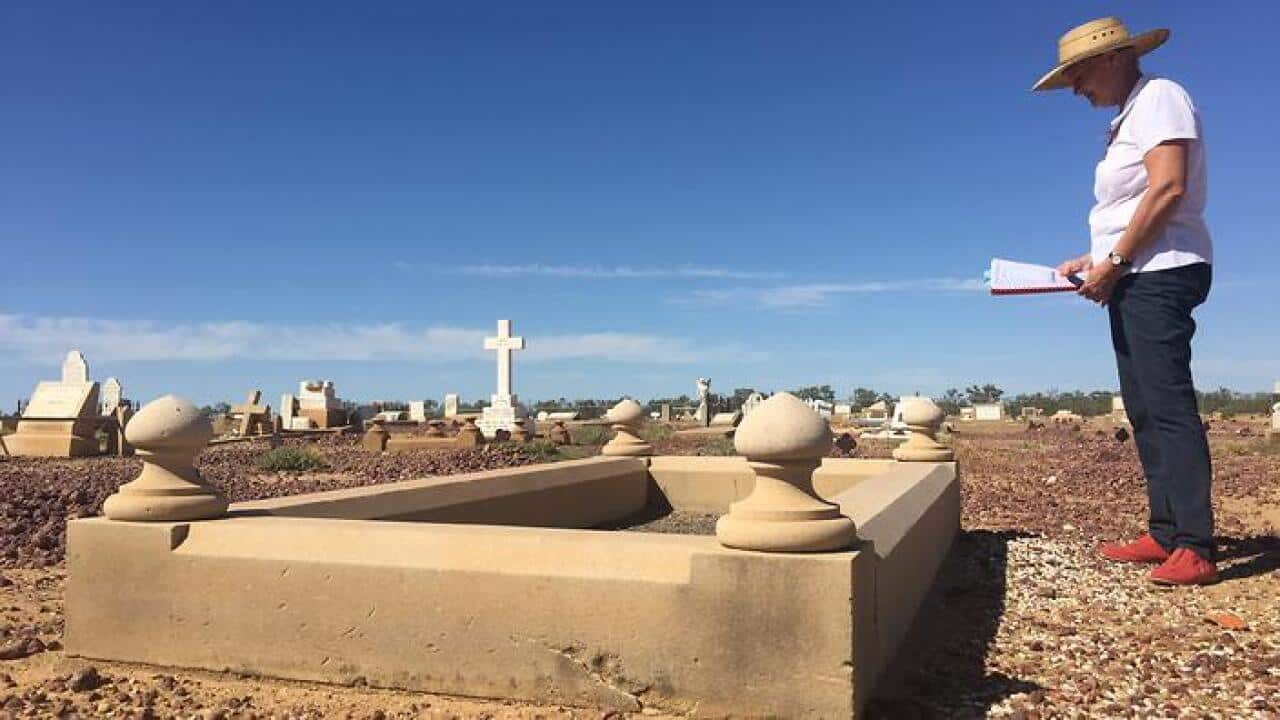 Longreach historian Kaye Kuhn in the cemetery researching Leo Dyball's unmarked grave