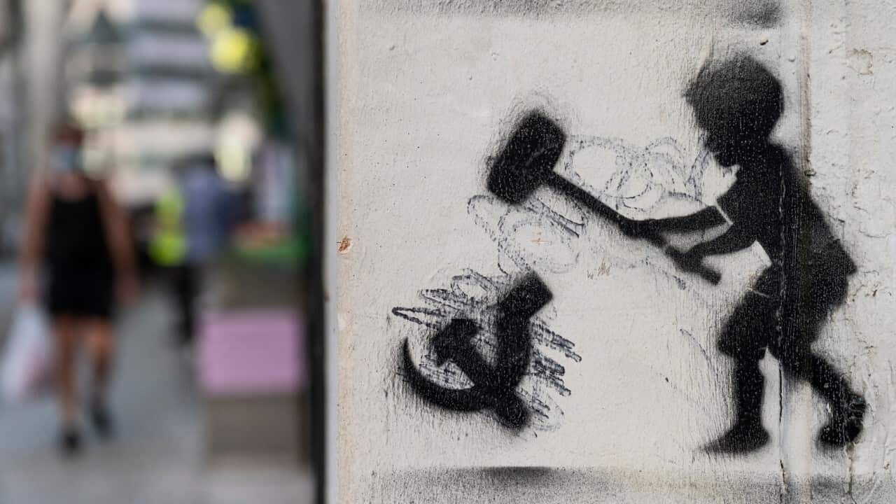 Hammering a Communisim symbol - Miguel Candela - SOPA Images - LightRocket via Getty Images