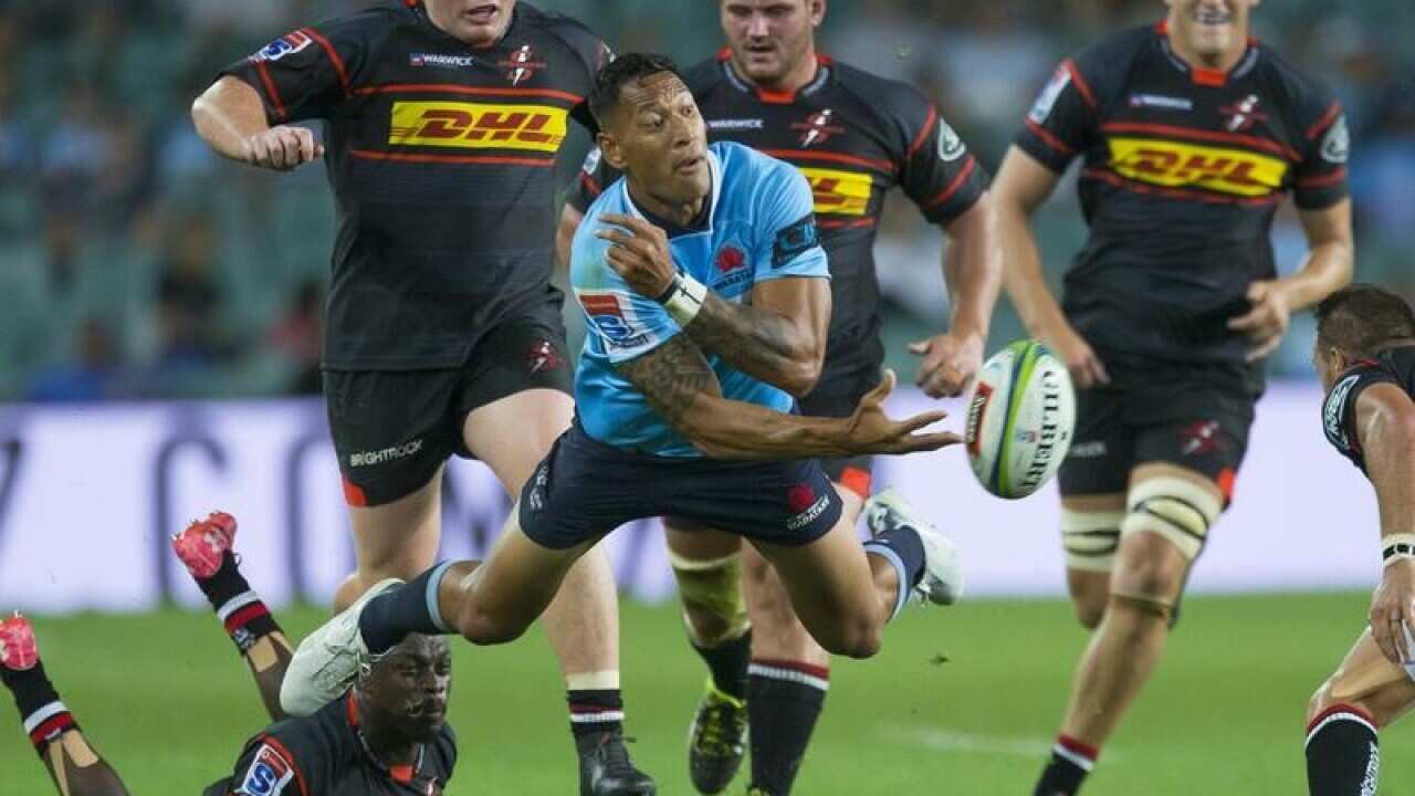 Israel Folau of the Waratahs makes a break and gets the ball away.