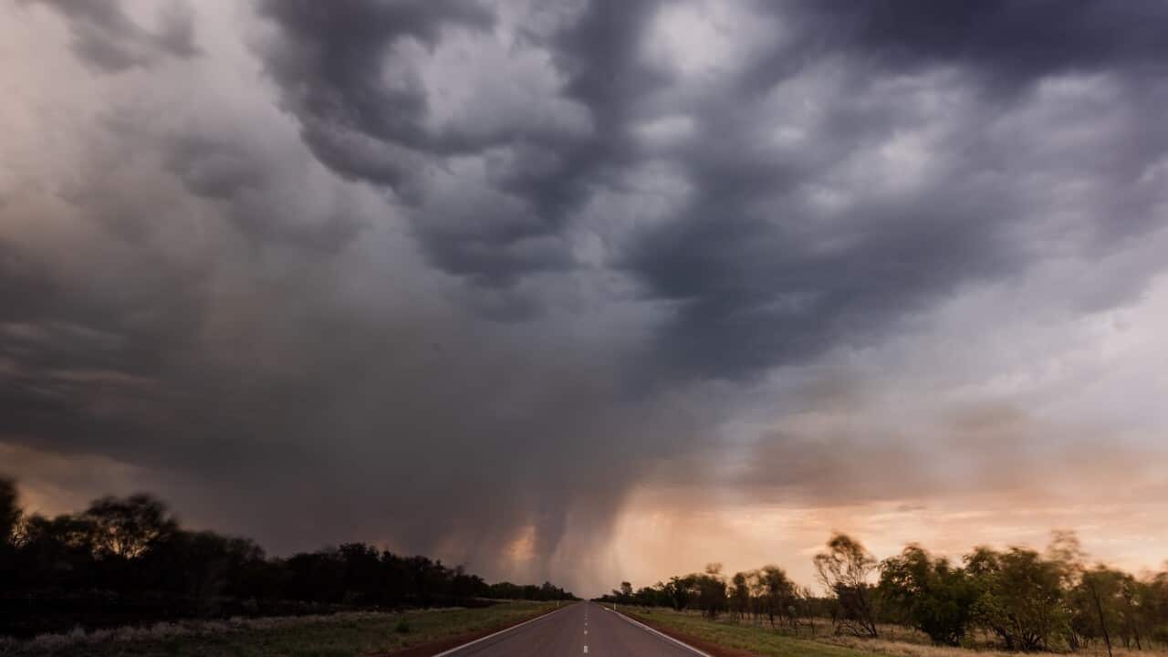 Empty highway heading towards a thunderstorm photographed in a remote part of Western Australia, Australia