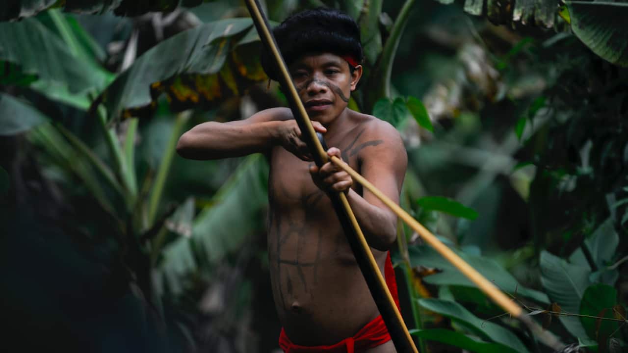 A Yanomami man with a bow and arrow.