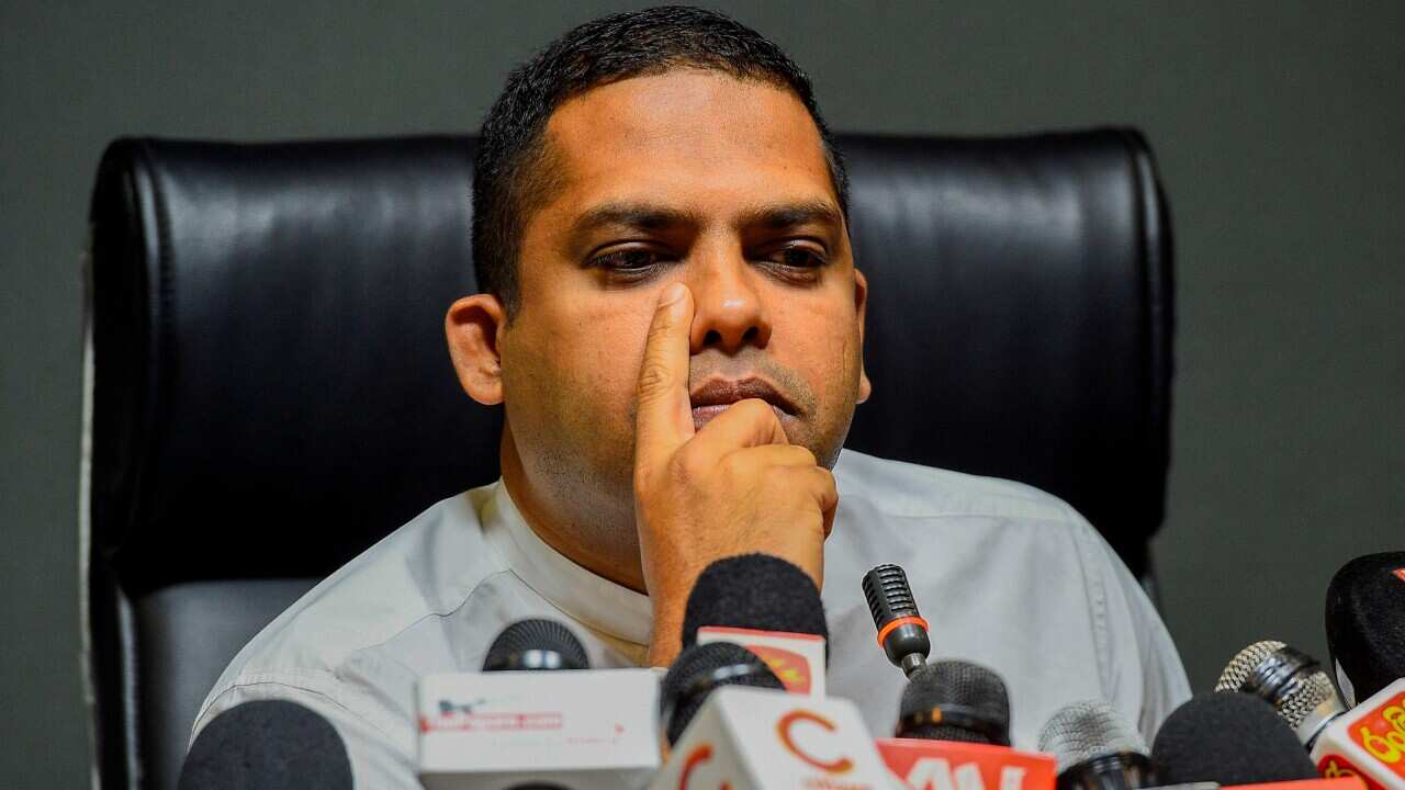 Sri Lankan Sports Minister Harin Fernando looks on as he speaks during a press conference in Colombo on August 22, 2019. - Sri Lankans with links to betting will be barred from the nation's cricket governing body amid persistent match-fixing claims, Sport
