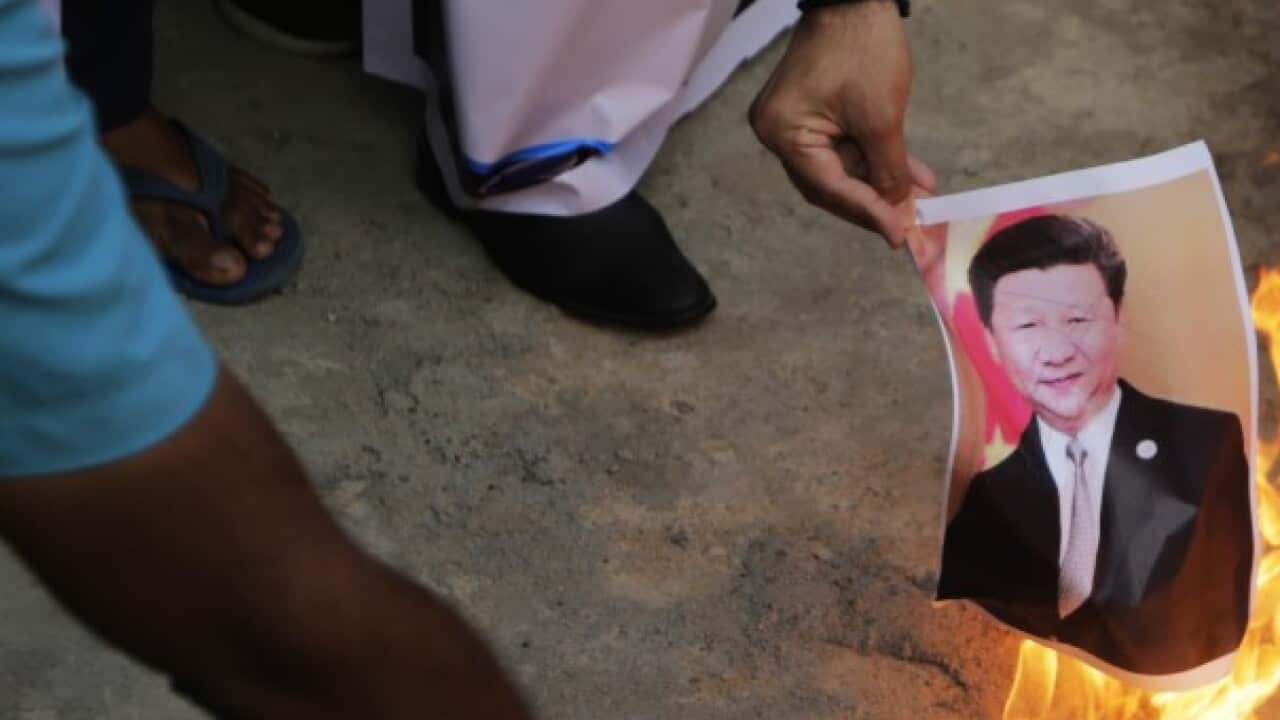 India man Burning Xi Jinping photo - AAP