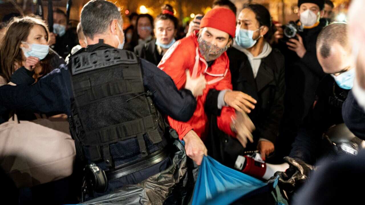 A protester supporting refugees tries to take a tent while police evacuates the camp. Refugees occupy the Republic Square (Place de la Republique) where 500 tents have been set up by the association Utopia 56. The association is asking for more accommodat