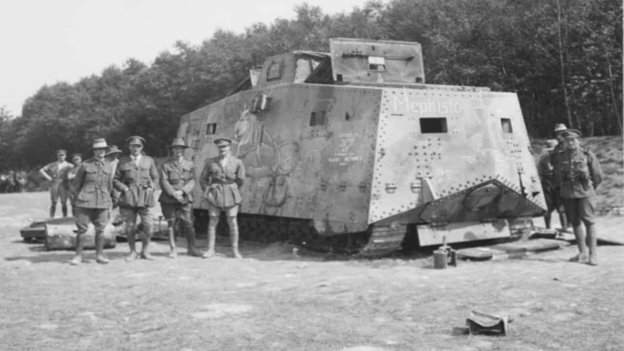 Australian soldiers posing with the captured 'Mephisto' A7V German tank