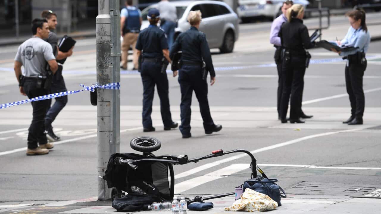 A pram is seen on the corner of Bourke and William Street after a man went on a rampage in a car through busy Bourke St mall, Melbourne, Friday, Jan. 20, 2017.