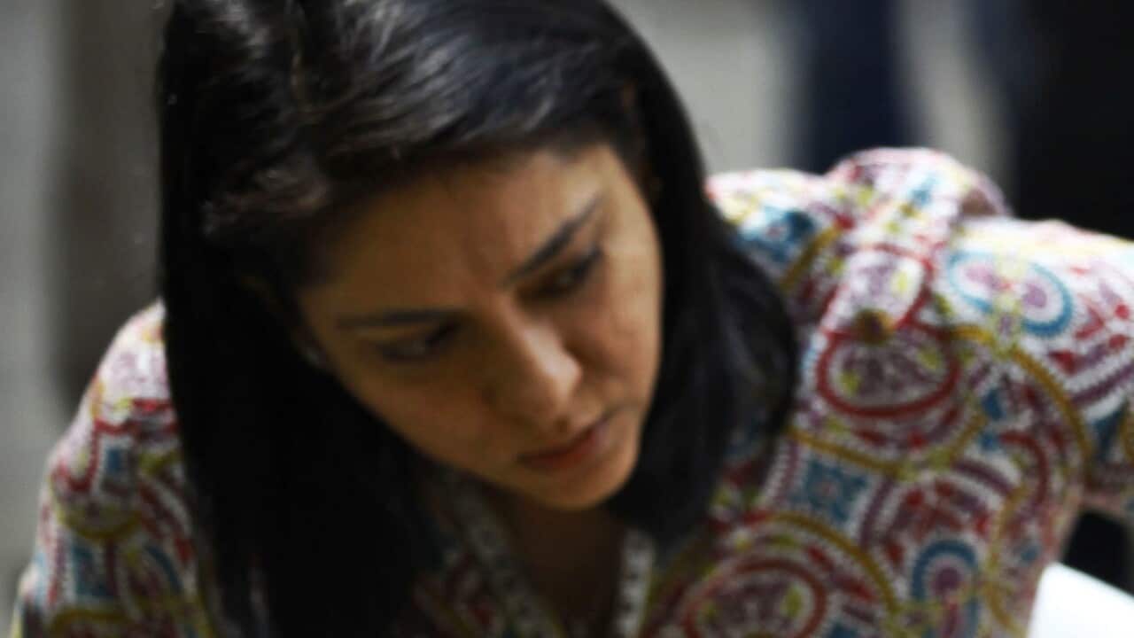 Sanjay Dutt, right breaks down as his sister Priya Dutt tries to console him during a press conference at his residence in Mumbai, India, March 28, 2013.
