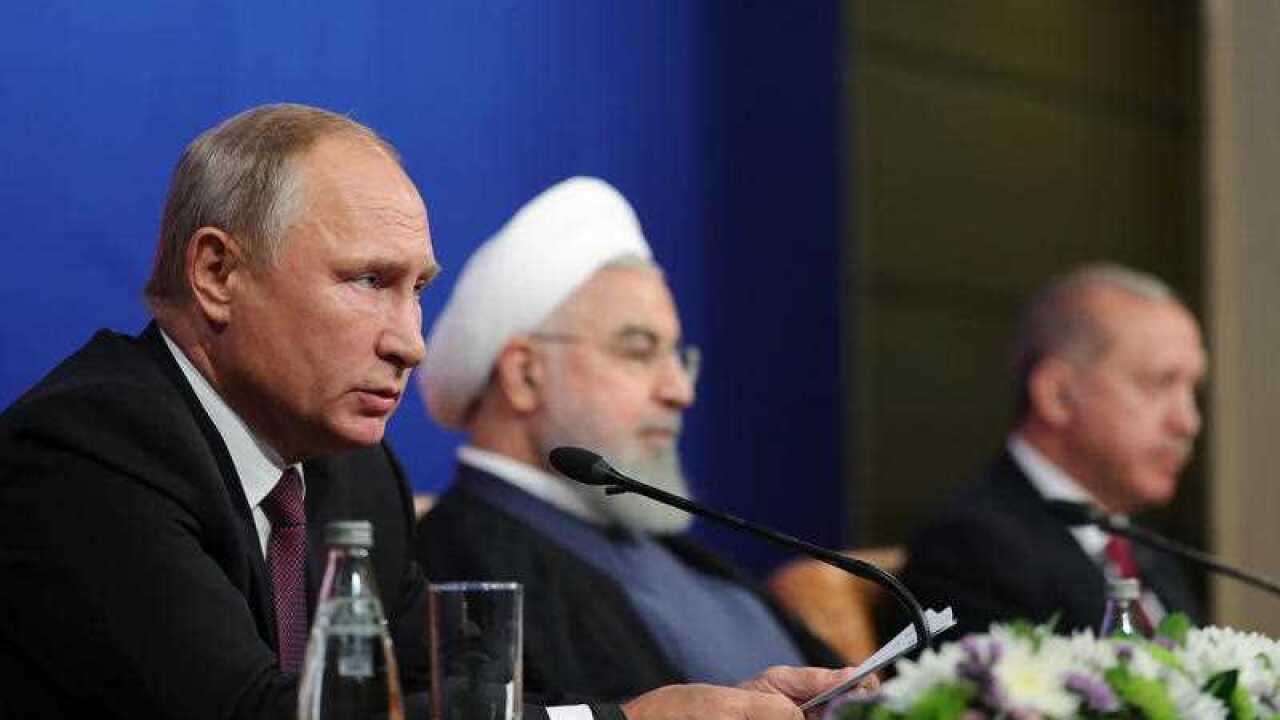 Iranian President Hassan Rouhan (C), Russian President Vladimir Putin (L), and Turkish President Recep Tayyip Erdogan (AAP)