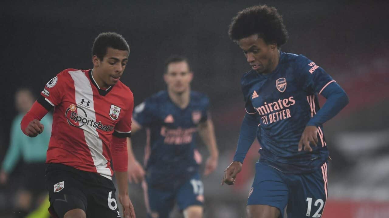 Caleb Watts of Southampton attempts to mark Arsenal's Willian