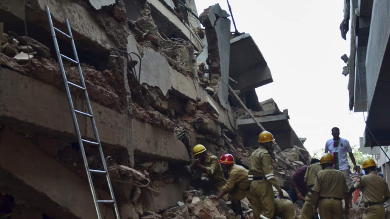 Rescue workers after a building collapsed in Canacona, India