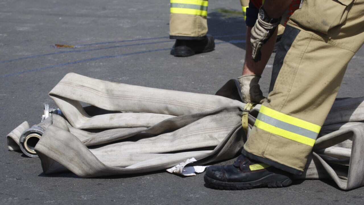Fire and police emergency services at a scene of a fire
