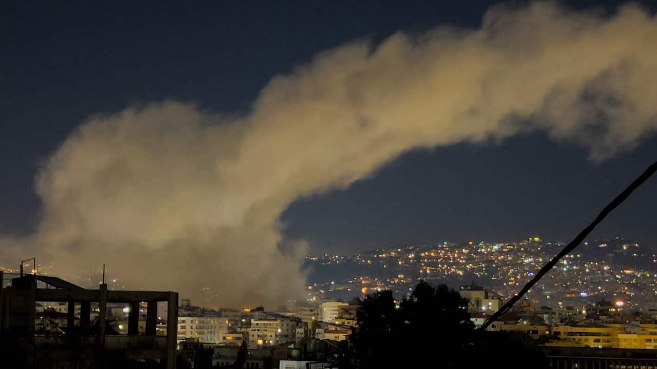 Smoke rises after airstrikes.