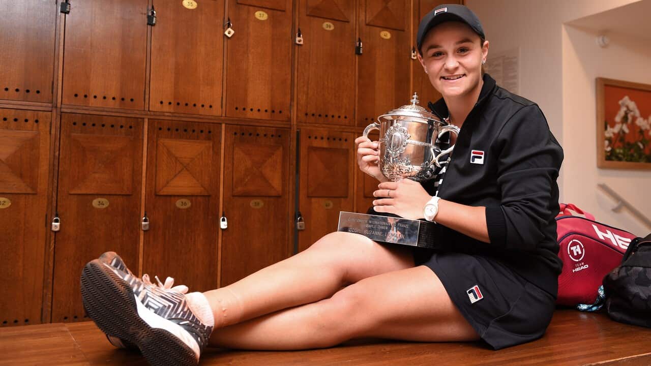 Ashleigh Barty holds Suzanne Lenglen trophy after winning the women's singles final match.