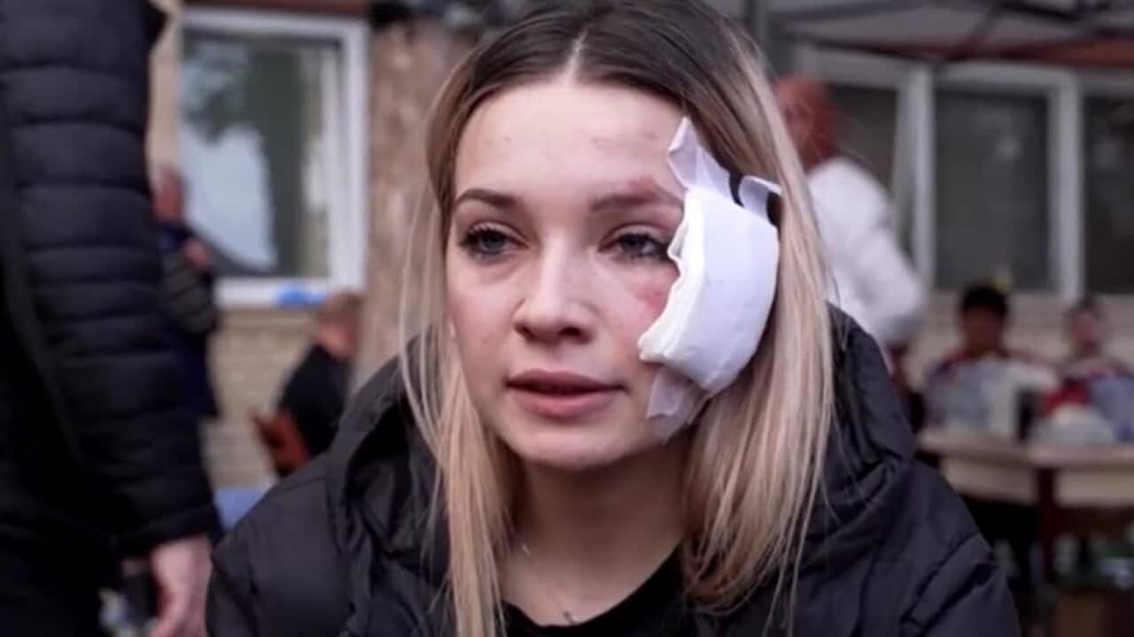 A young woman with a big bandage on her face