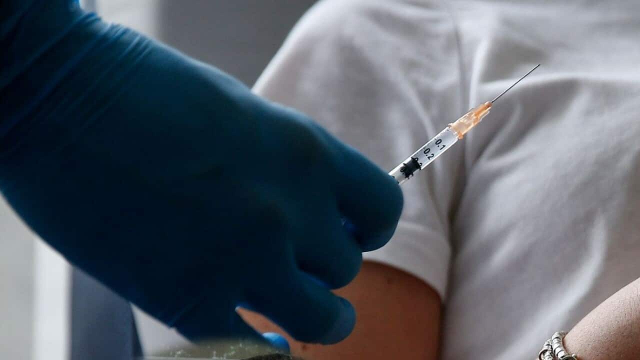 A pregnant women receiving COVID vaccine
