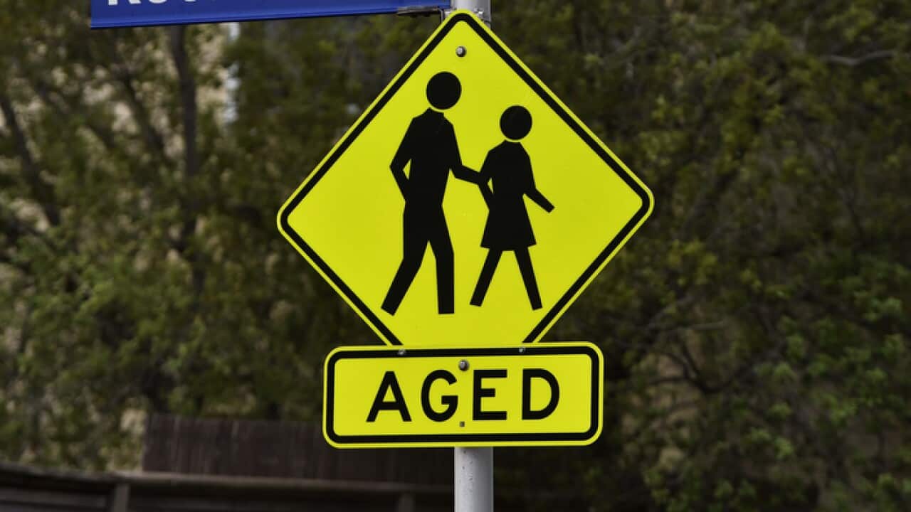 A hazard sign warning drivers of elderly members crossing the street is seen in Kensington, Melbourne, Saturday, March 30, 2019.