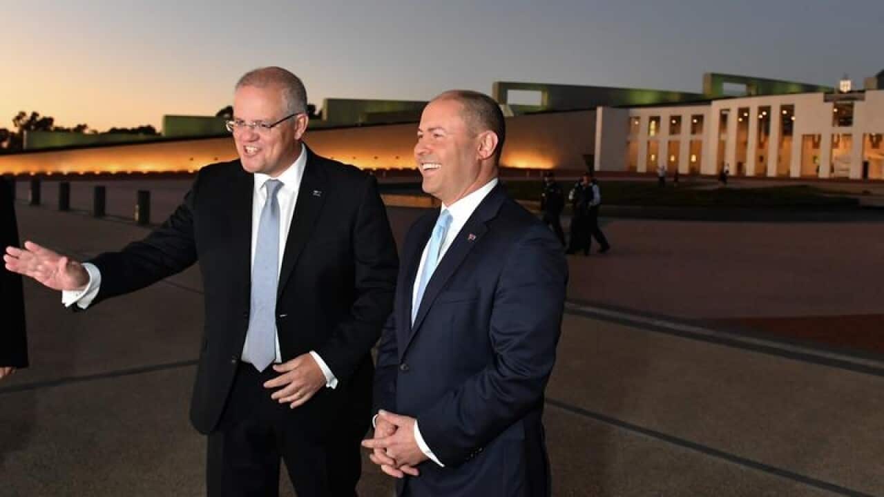 Scott Morrison and Treasurer Josh Frydenberg outside Parliament House.