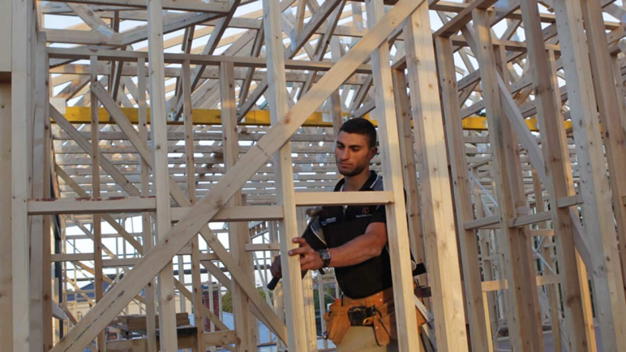 Tradesman at a new housing construction site.