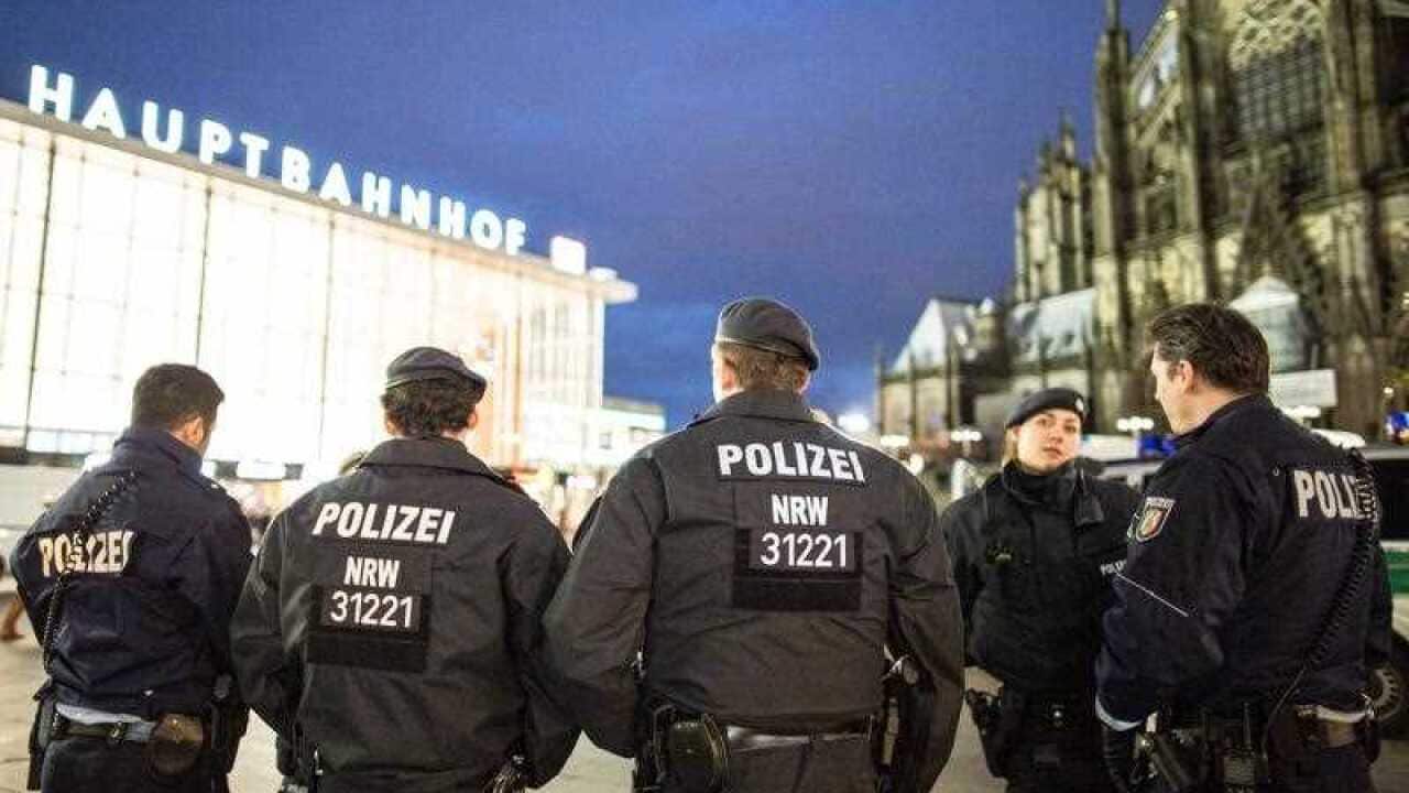 Police officers stand outside the main station in Cologne, Germany, 06 January 2016. After sexual assaults on women at New Year, there is an increased police presence at the main station. EPA/MAJA HITIJ