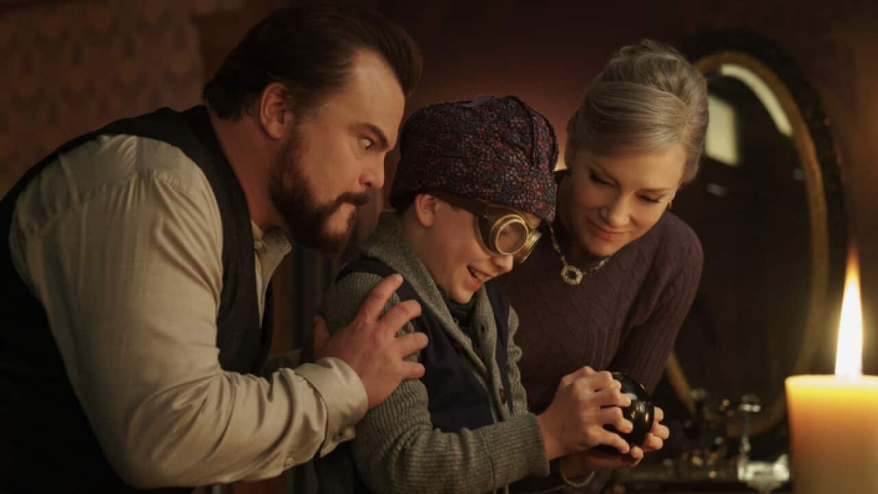 This image shows Jack Black, from left, Owen Vaccaro and Cate Blanchett in a scene from "The House With A Clock in Its Walls."