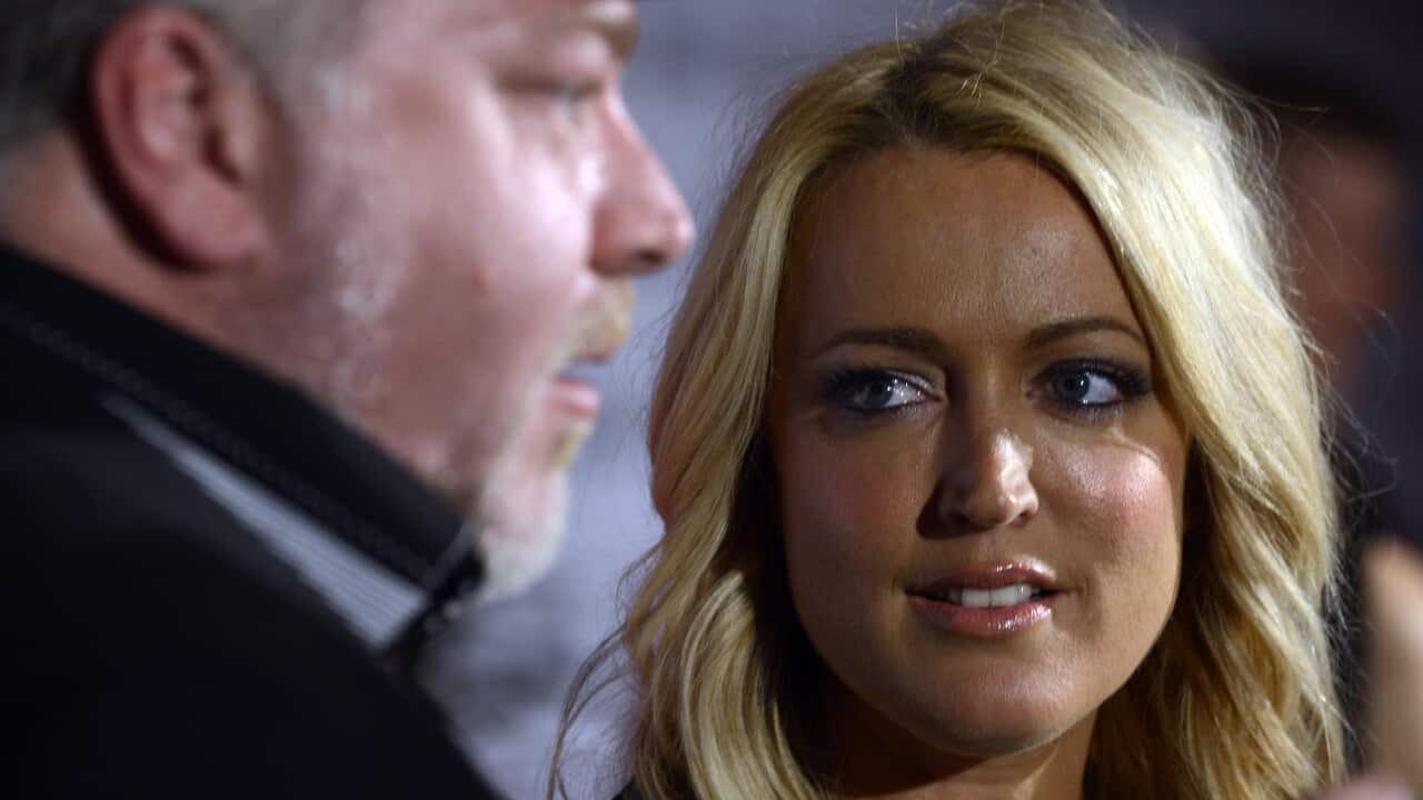 A close up of a man and woman's faces.