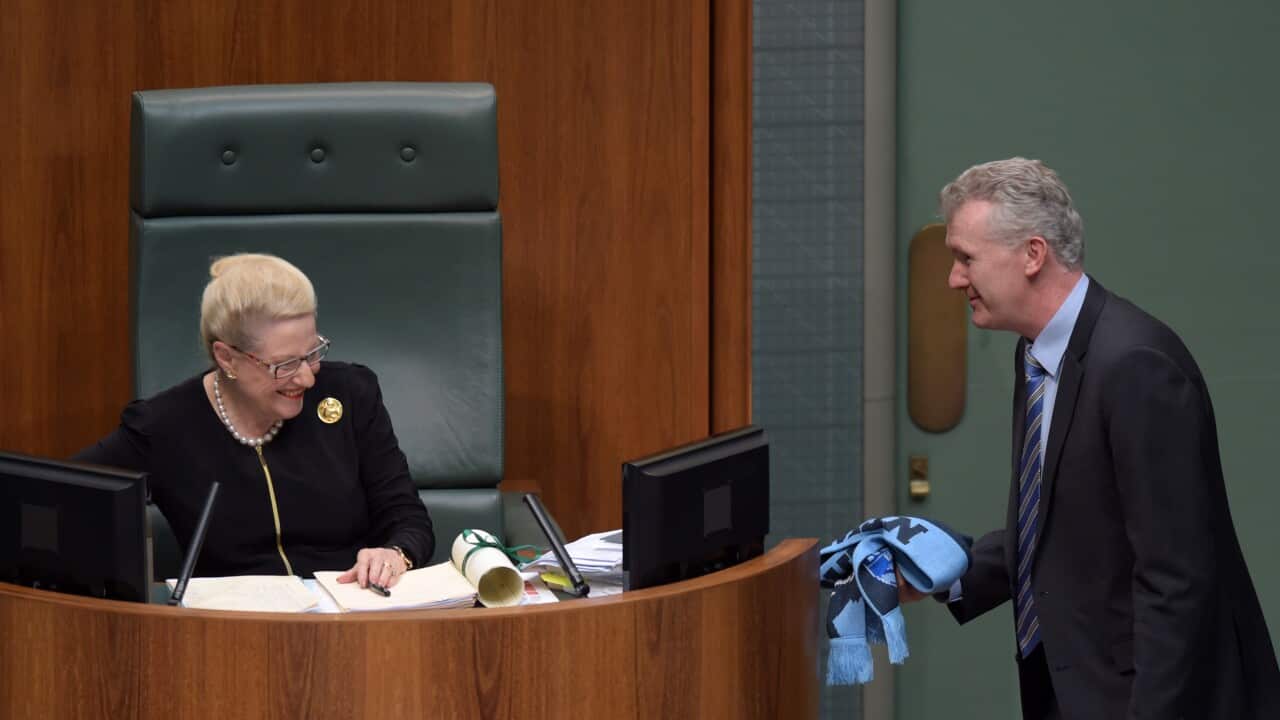 The manager of Opposition Business Tony Burke receives back his NSW Blues scarf from speaker Bronwyn Bishop during House of Representatives Question Time at Parliament House in Canberra, Wednesday, May 27, 2015. (AAP Image/Lukas Coch) NO ARCHIVING